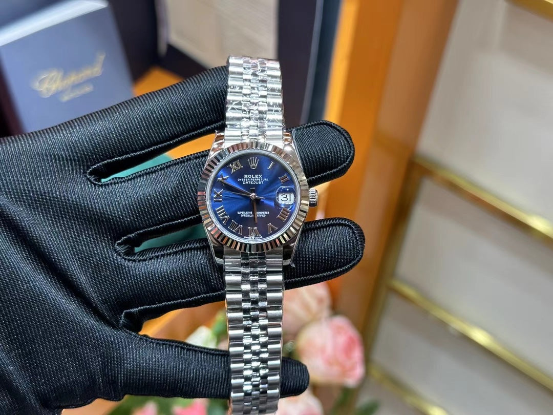 Rolex Datejust – Blue Dial with Roman Numerals, White Gold Fluted Bezel & Steel Jubilee Bracelet