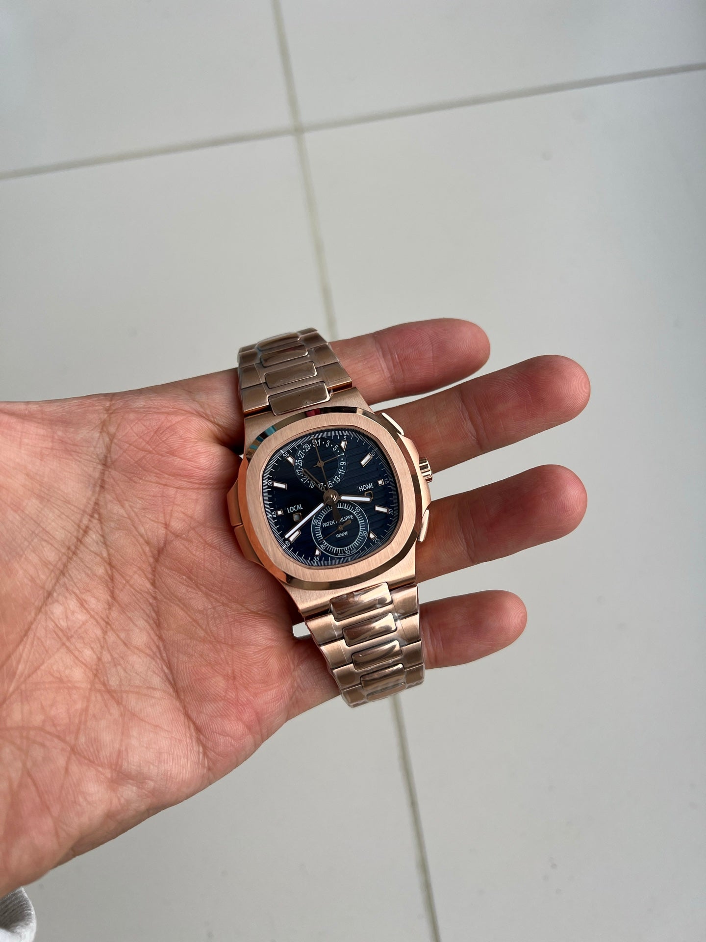 Patek Philippe Nautilus Travel Time Chronograph 5990/1R-001 in Rose Gold with Blue Sunburst Dial