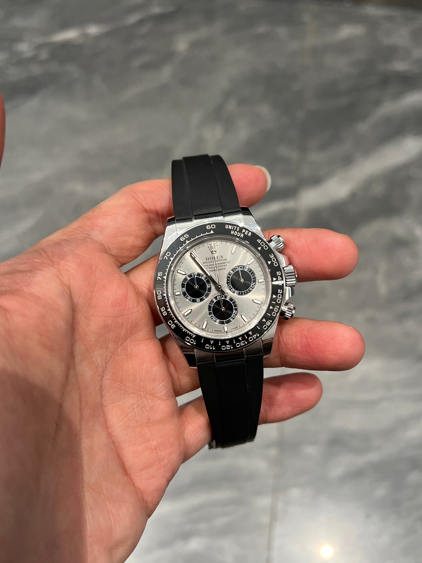 Rolex Oyster Perpetual Cosmograph Daytona in 18k White Gold with Steel/Silver Dial on Black Oysterflex Bracelet