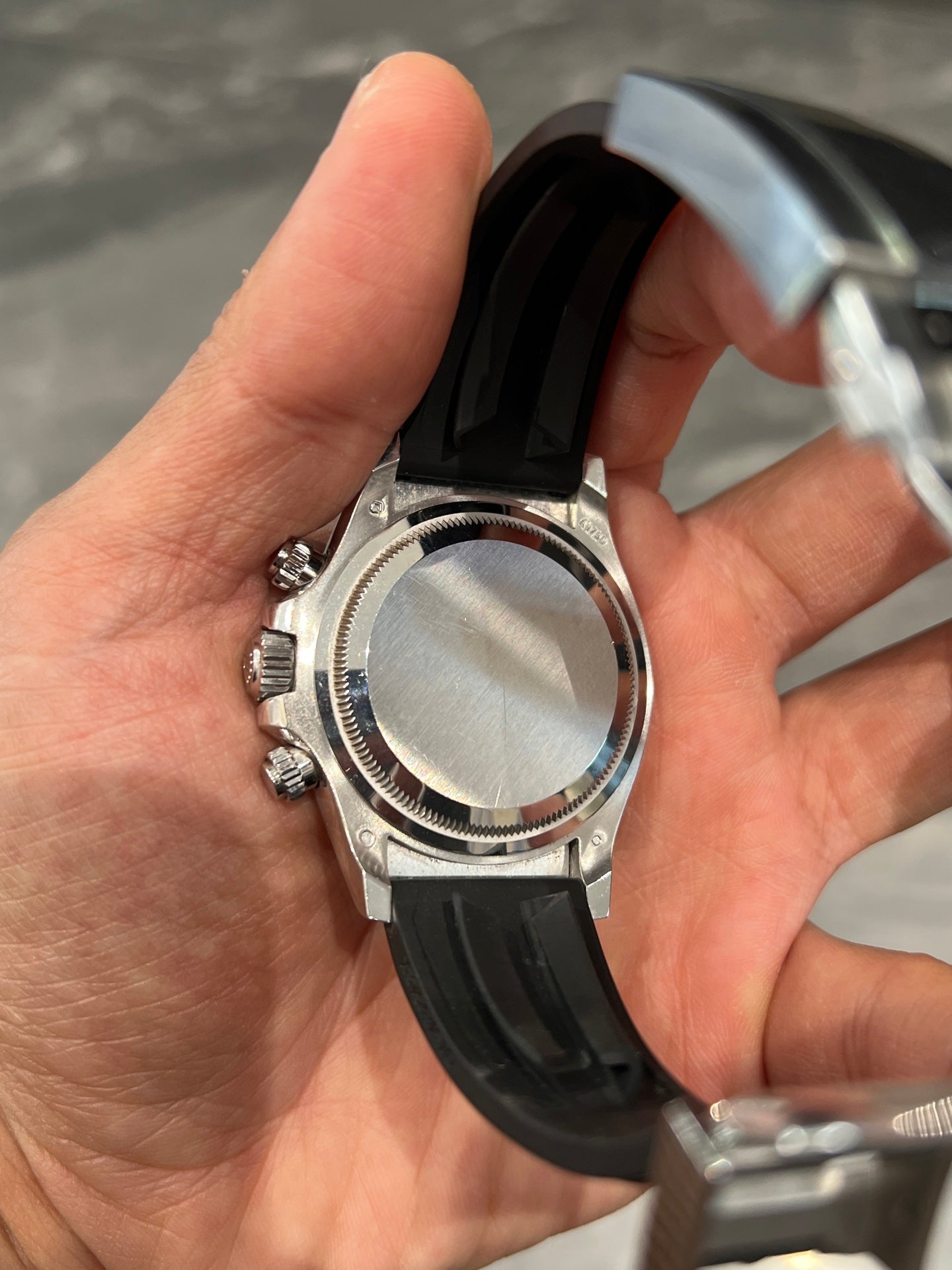 Rolex Oyster Perpetual Cosmograph Daytona in 18k White Gold with Steel/Silver Dial on Black Oysterflex Bracelet
