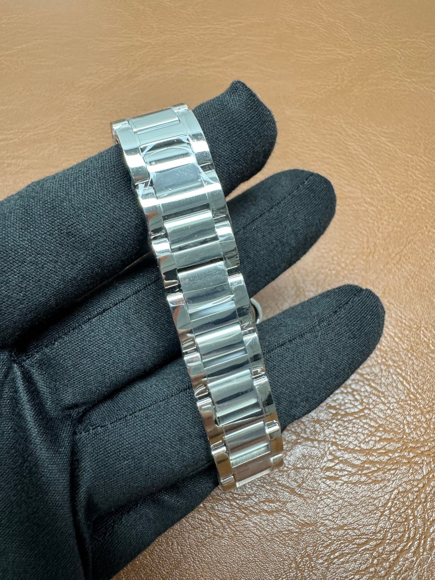 Cartier Ballon Bleu watch featuring a two-tone steel and gold bracelet and a distinctive pink dial