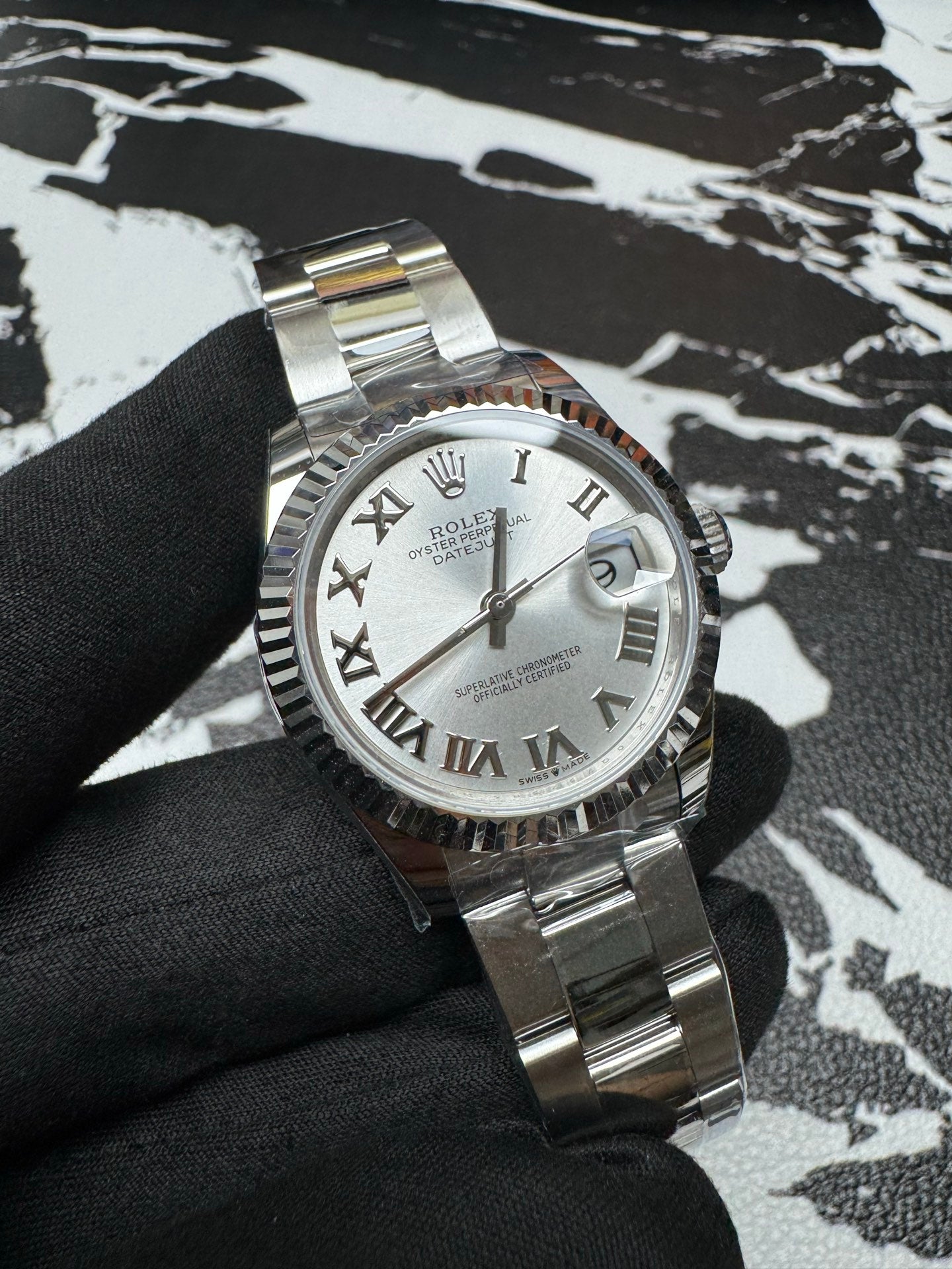 Rolex Datejust 31 Silver Roman Dial Fluted Bezel