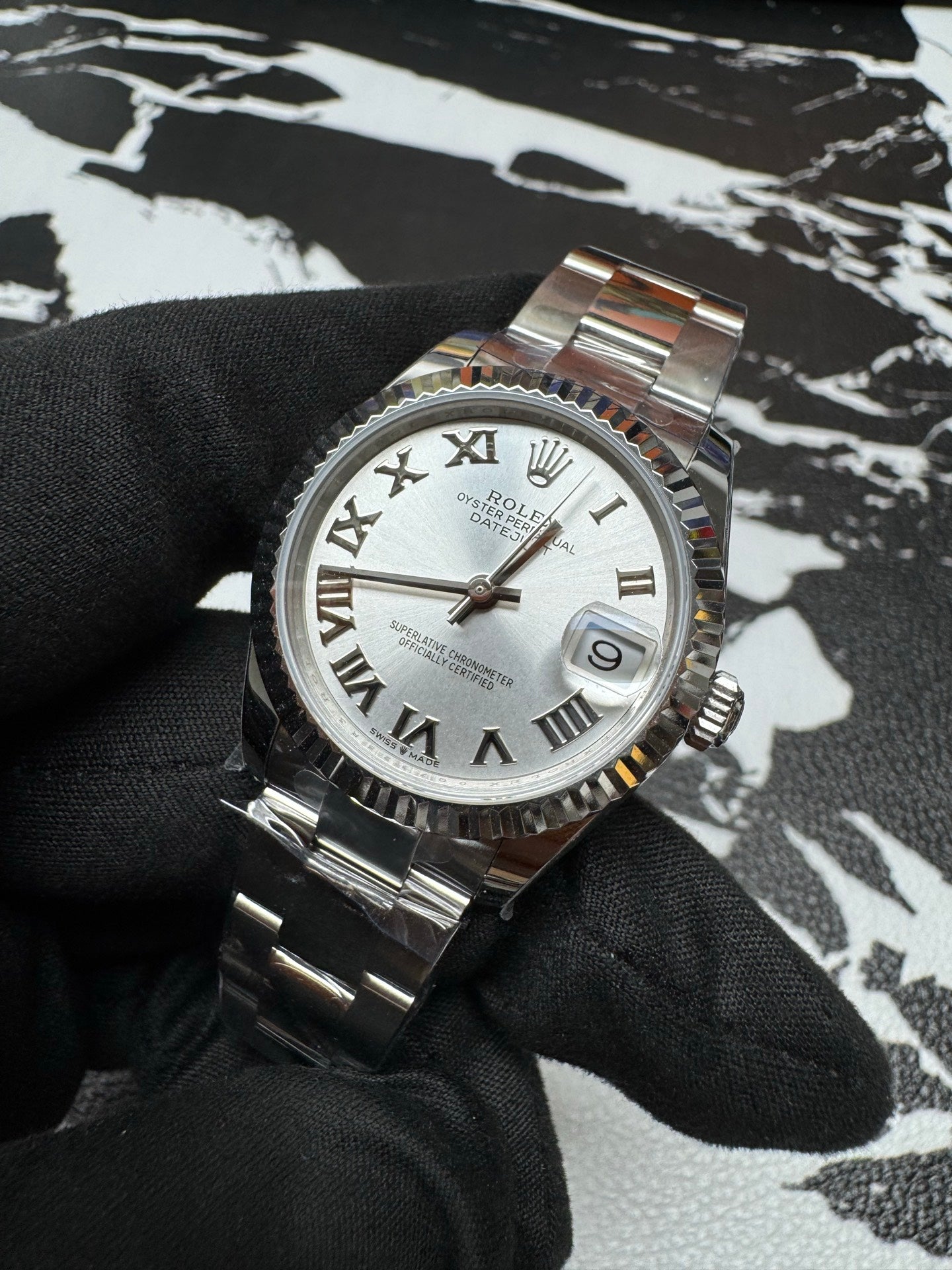 Rolex Datejust 31 Silver Roman Dial Fluted Bezel